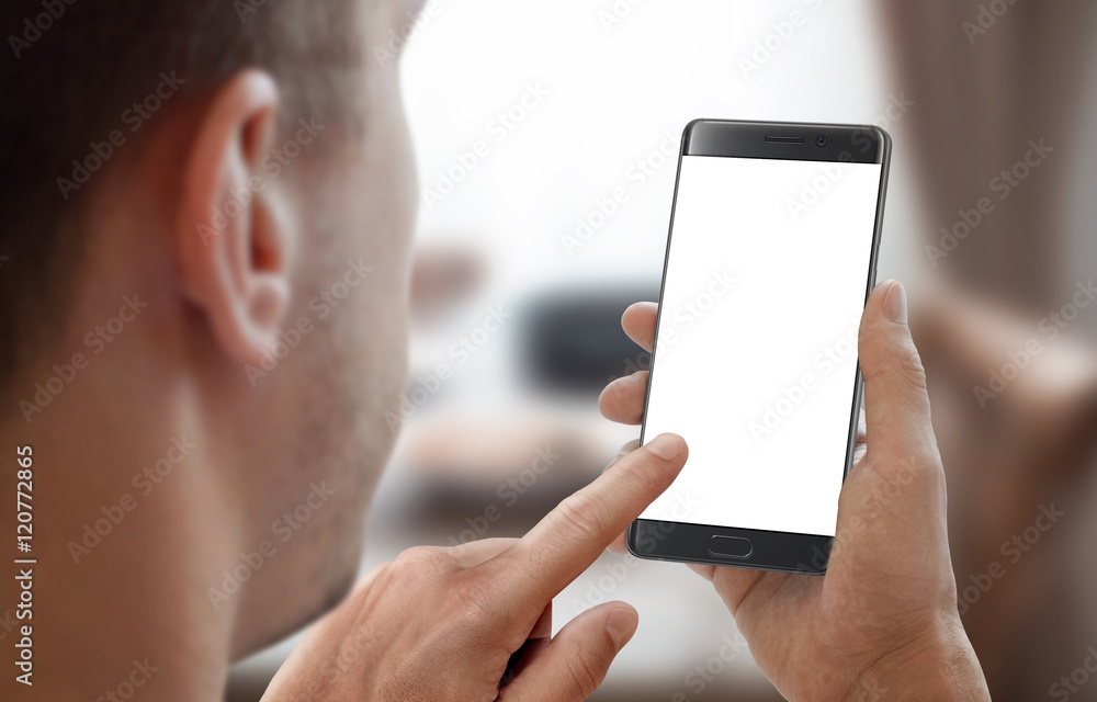 Poster man hold smartphone in room interior. left hand touch isolated display for mockup.