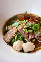 Asian rice noodle recipe in white bowl.