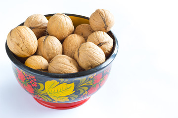 Walnuts in a color cup on the  White background