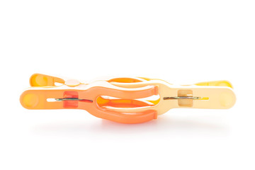 Plastic clothes pegs isolated on white background.