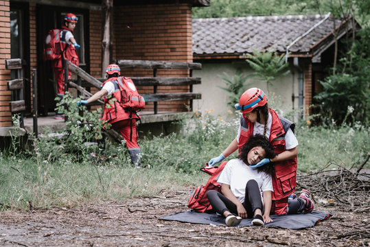 Rescue team helping injured female victim