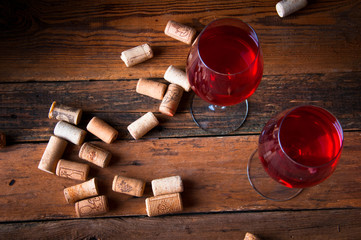 Two glasses of red wine and corks. Copyspace. Top view