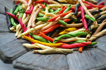 Traditional colorful Italian dried homemade pasta fusilli with e