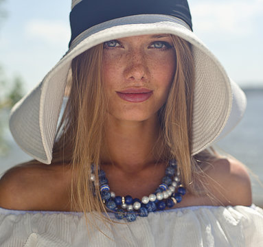 Beautiful girl in white hat