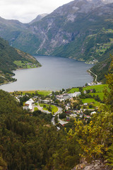 Famous Norwegian fjord, Geirangerfjord, with a Geiranger town in summer day