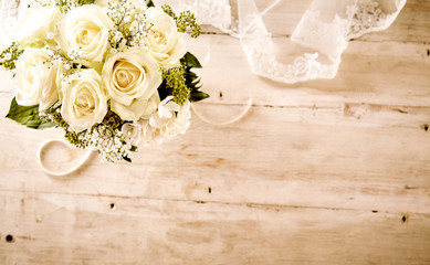 Bridal Bouquet with White Roses and Lace Veil