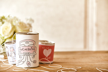 Set of decorated cans with strings with bouquet