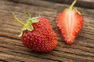 Strawberry on rustic wooden background. Selective focus