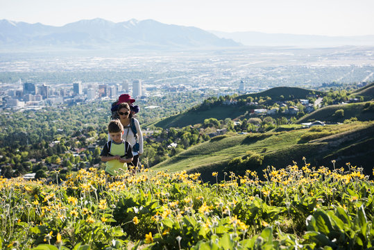 Mother with son and daughter, hiking the Bonneville Shoreline Trail in the Wasatch Foothills above Salt Lake City, Utah, USA