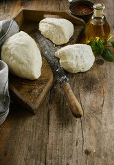 Preparing pizzas in a country or farm kitchen