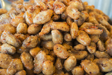 Pickled fruits, Hot and spicy preserved santol fruit, dessert native Thailand, Thai snack, sprinkle with sugar, chili powder, salt and dried shrimp.