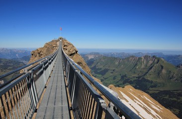 Suspension bridge connecting two peaks in the Alps