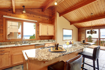 Wooden trim home with open floor plan. Kitchen with granite counter top.