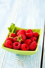 raspberries on wooden surface