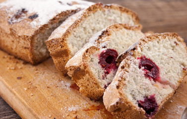Sponge cake sliced on cutting board. Selective focus.