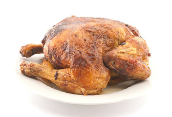 Whole roasted chicken on white background.