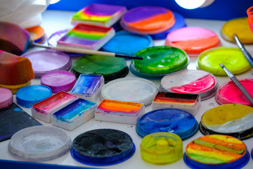 Make-up palettes, brushes and other tools close up