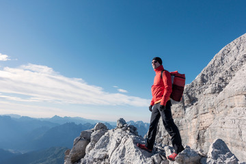 BASE jumper checking the exit spot and the wind, Italian Alps, Civetta, Alleghe, Belluno, Italy