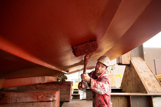 Workwear repairing ship in shipyard
