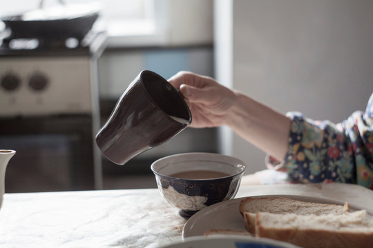 Cropped View Of Woman Making A Cup Of Tea