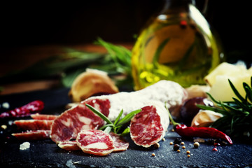 Jerked Italian salami with rosemary, spices, olives and oil. Dar