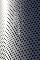 Metal surface. The metal is full of small holes.