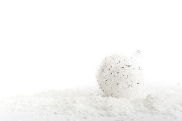 Christmas white balls on snow Closeup. Christmas background.