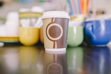 coffee cup in coffee shop without space for text, soft focus