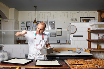Baker working in bakery