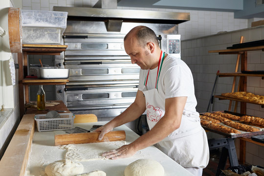 Baker working in bakery