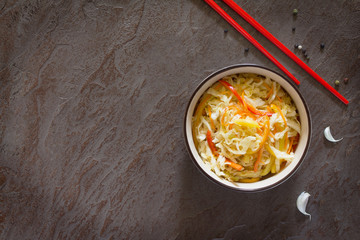 Korean salad of cabbage, carrots, sweet peppers - kimchi. Top vi