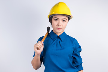 Engineer girl holding a hammer