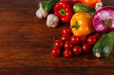 Fresh vegetables on brown wood background with copy space