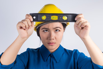 Engineer girl holding the water level ruler
