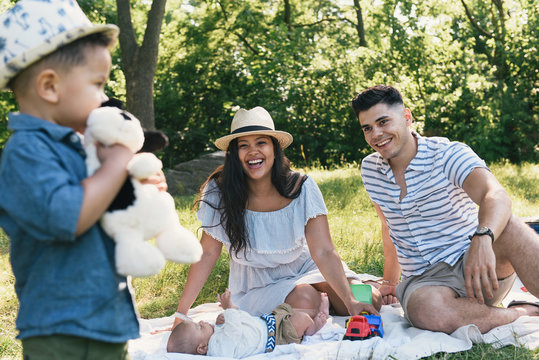 Family with two kids on picnic in park
