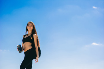 Fitness girl with a shaker