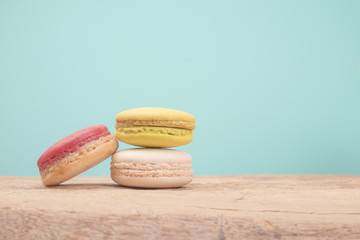 Sweet and colourful french macaroons on retro vintage background