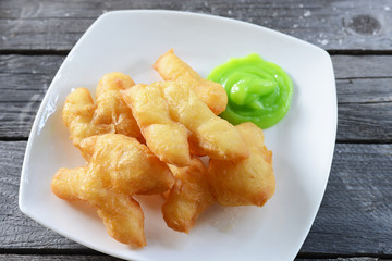 deep-fried dough stick (Patongko) with Pandan custard.
