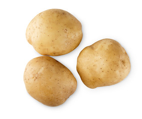 Stack of raw potatoes closeup isolated on white background