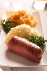 Grilled sausages,potatoes and stewed cabbage