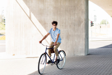 Fototapeta premium young hipster man riding fixed gear bike
