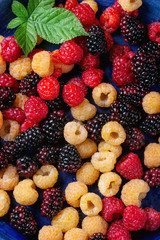 Heap of colorful raspberries 