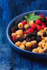 Heap of colorful raspberries 