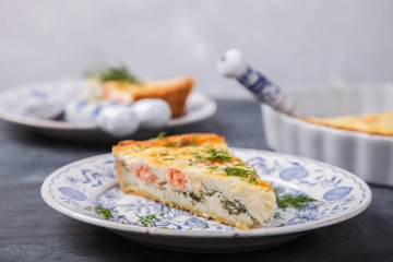 quiche an open pie with salmon,spinach and dill.Savory pastries.selective focus.