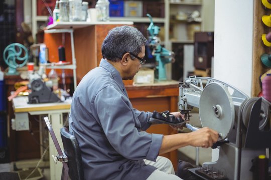 Shoemaker using sewing machine