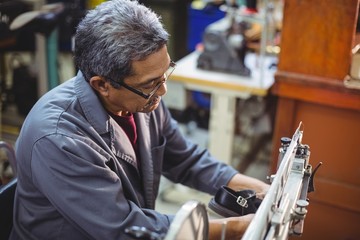 Shoemaker using sewing machine