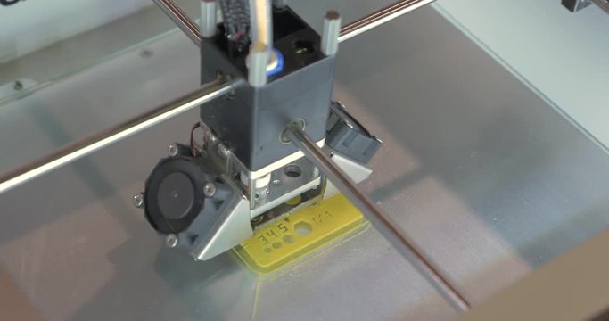 In ECC Sokolniki, Moscow at exhibition of 3D Expo seen how 3D printer prints a school ruler. Printing technology