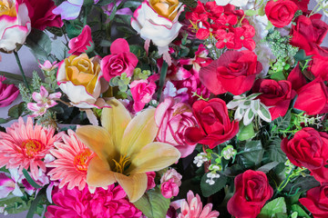 Artificial flowers bouquet background.