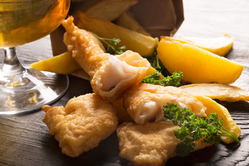 Traditional British fish and chips with parsley