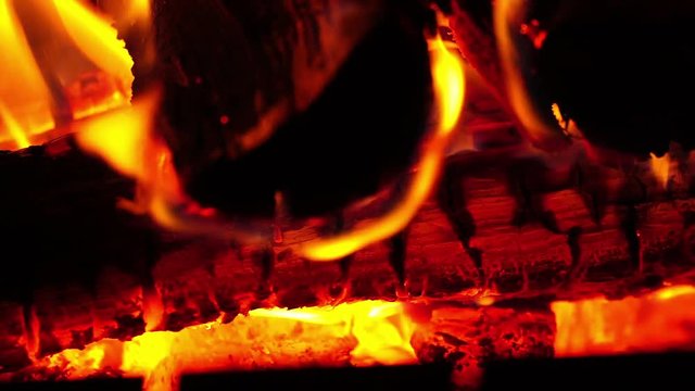 macro footage fire smoldering coal in fireplace firewood